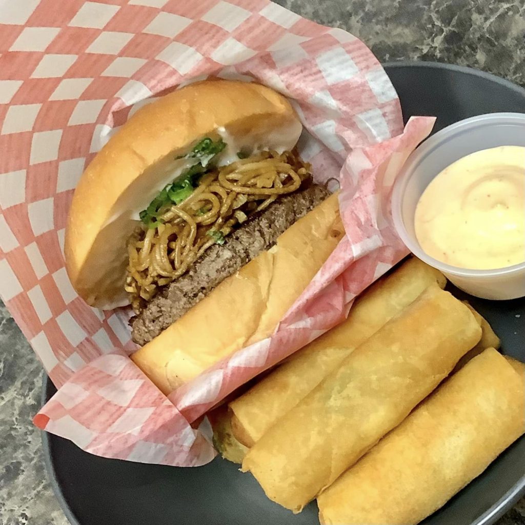 BurgerJoy Burger with fried noodles and Spring Rolls